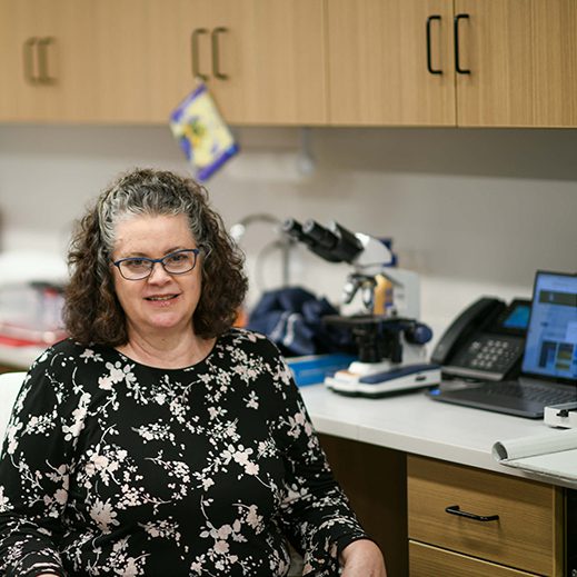 Ginny By Table With Equipment