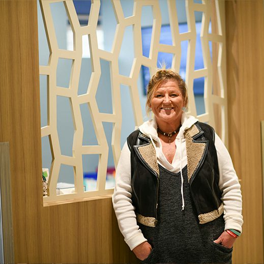 Wendy Standing By Decorative Wall Art